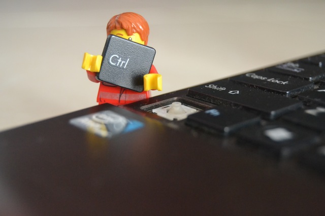 Lego man holding keyboard control key