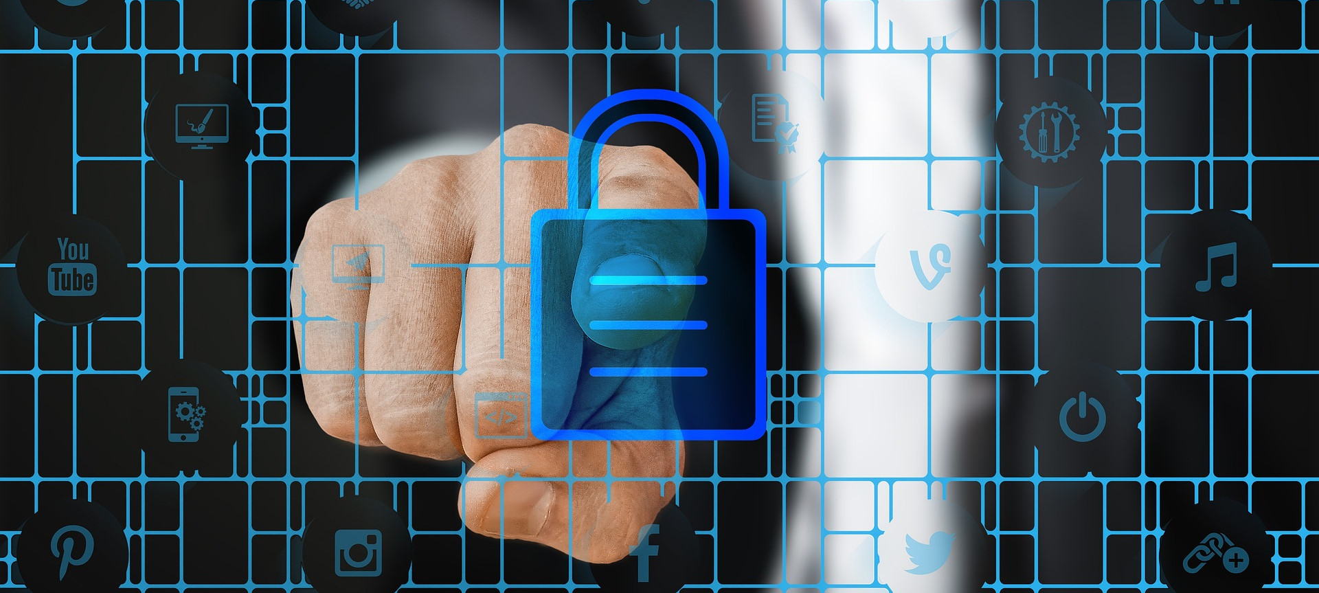 Man's finger pointing at lock with tech symbols in background