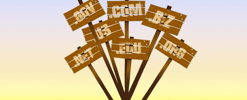 Top level web domains on wooden signs